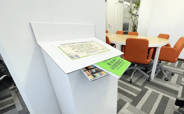 A book is inserted into the collection box